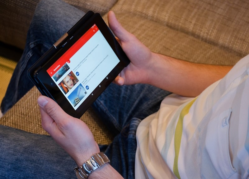 Person looking on youtube on a tablet