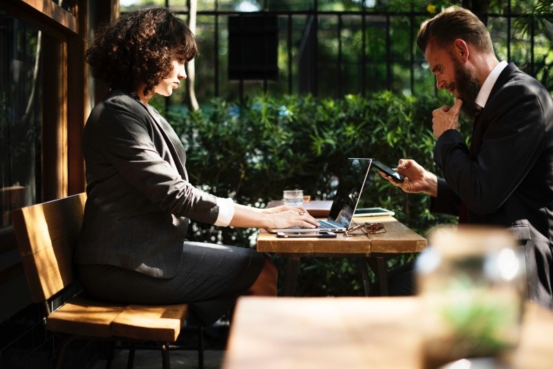 woman and men in a coffee shop