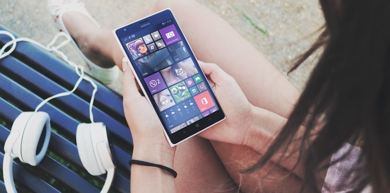 Person holding a mobile phone