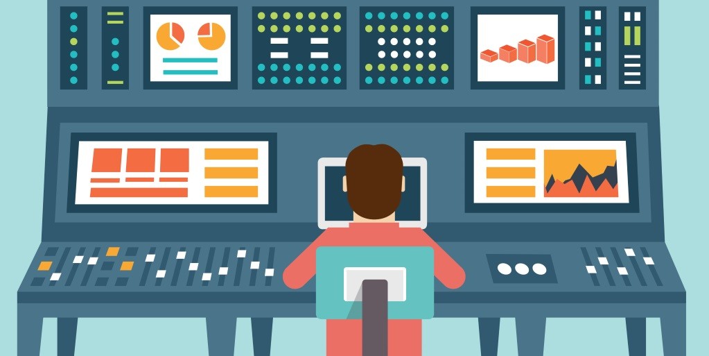 Visual with a man sitting in front of a controling panel