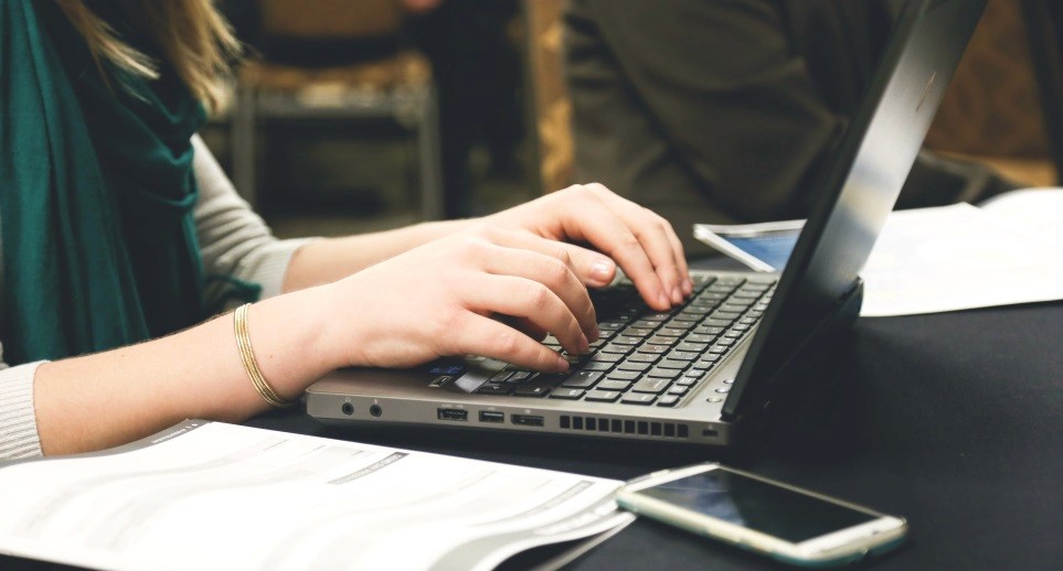 Person typing on a laptop